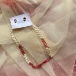 Pearl and maroon beads
