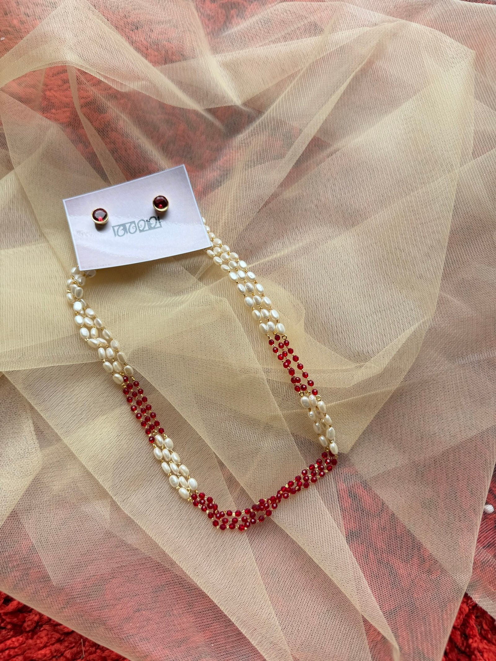 Pearl and maroon beads